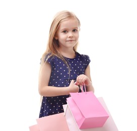 Photo of Little girl with shopping bags on white background