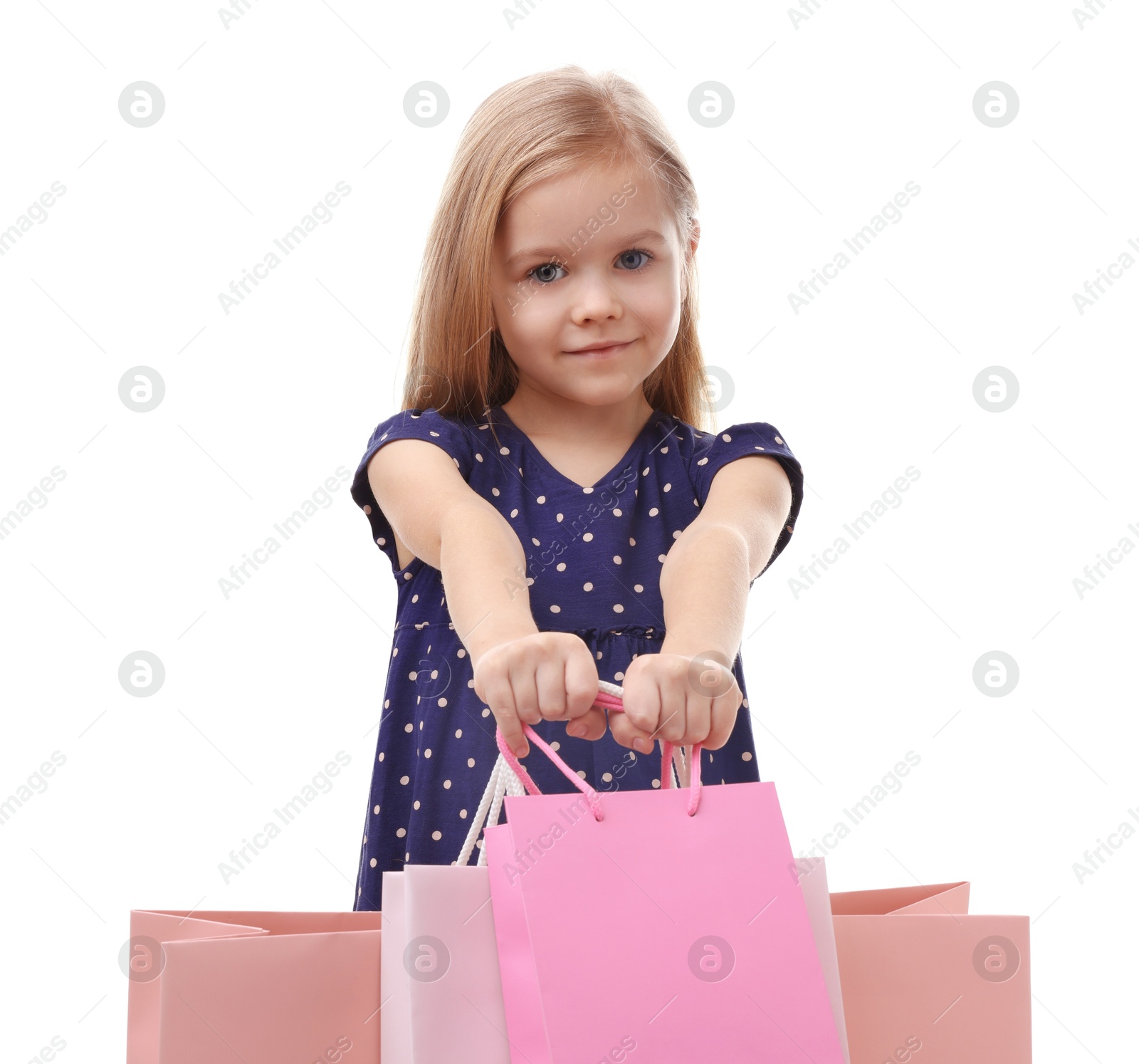 Photo of Little girl with shopping bags on white background