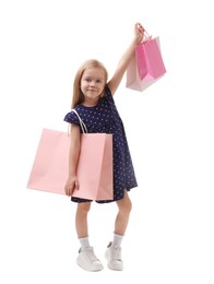 Photo of Little girl with shopping bags on white background