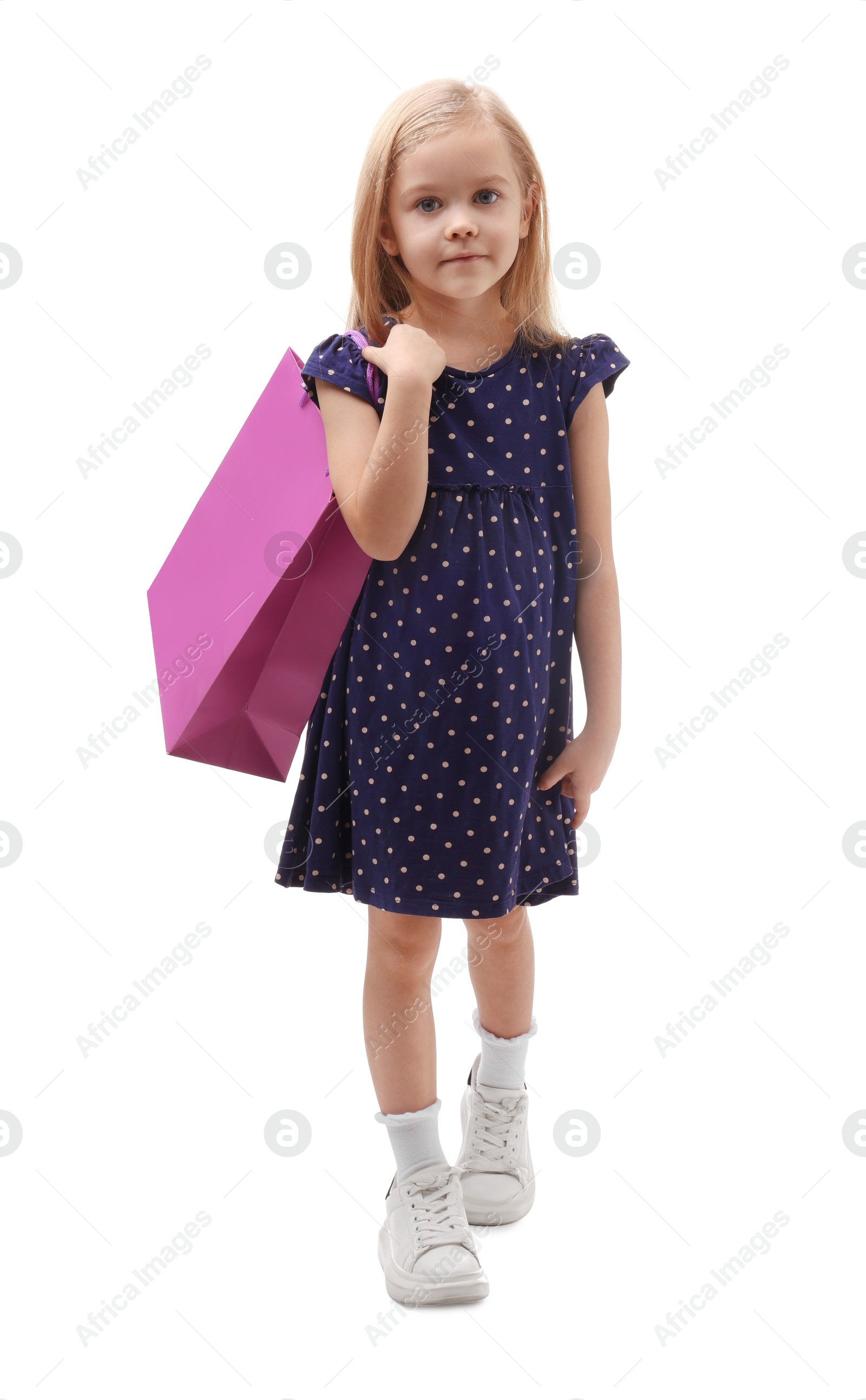 Photo of Little girl with shopping bag on white background