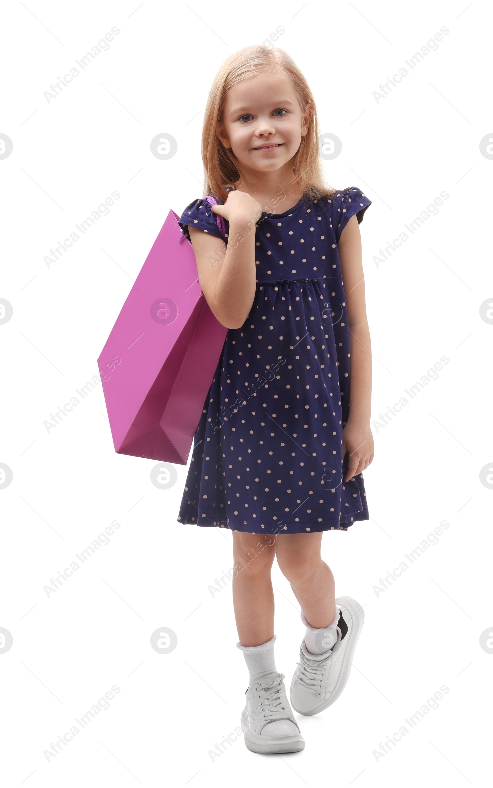 Photo of Little girl with shopping bag on white background