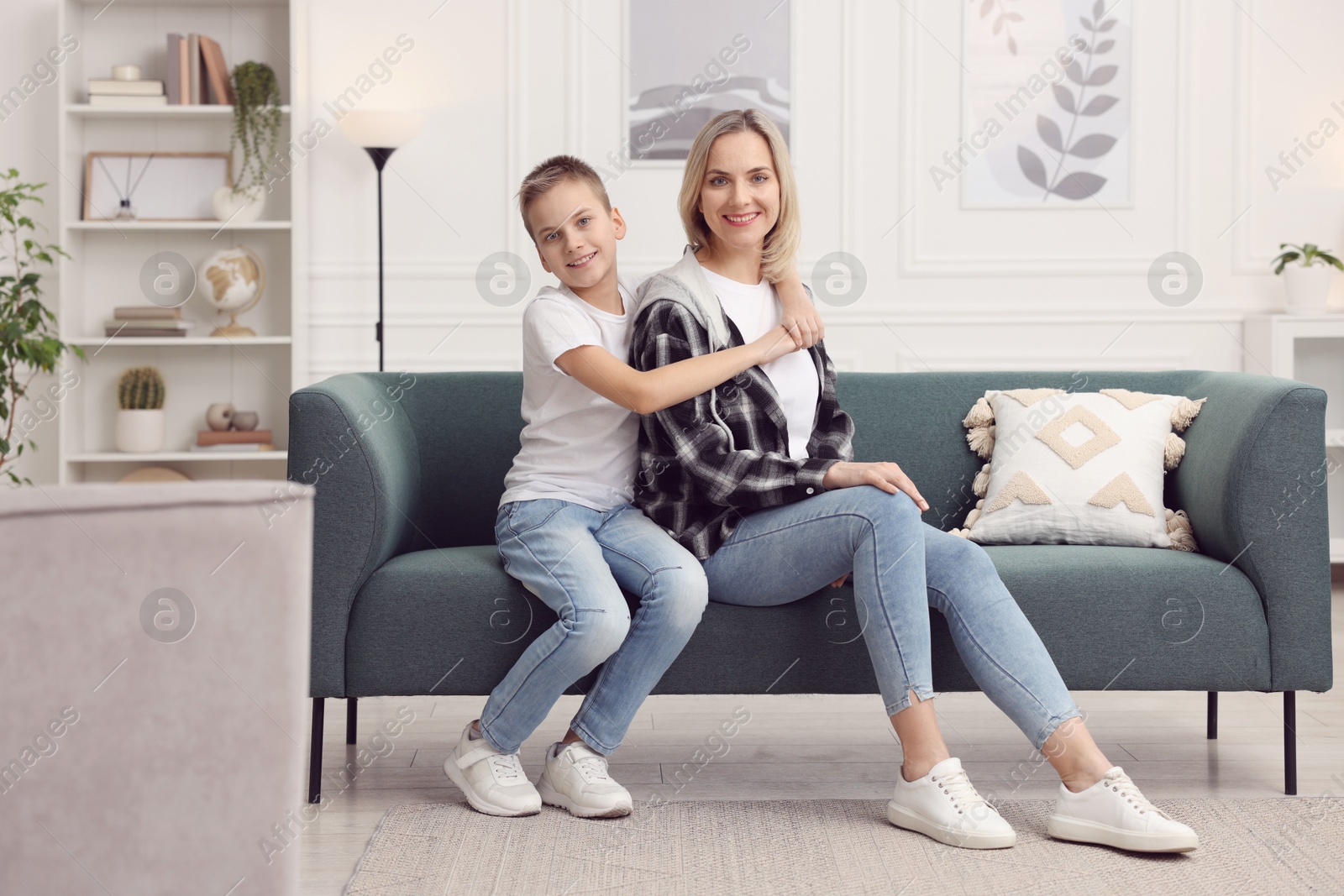 Photo of Mother and son on sofa at home