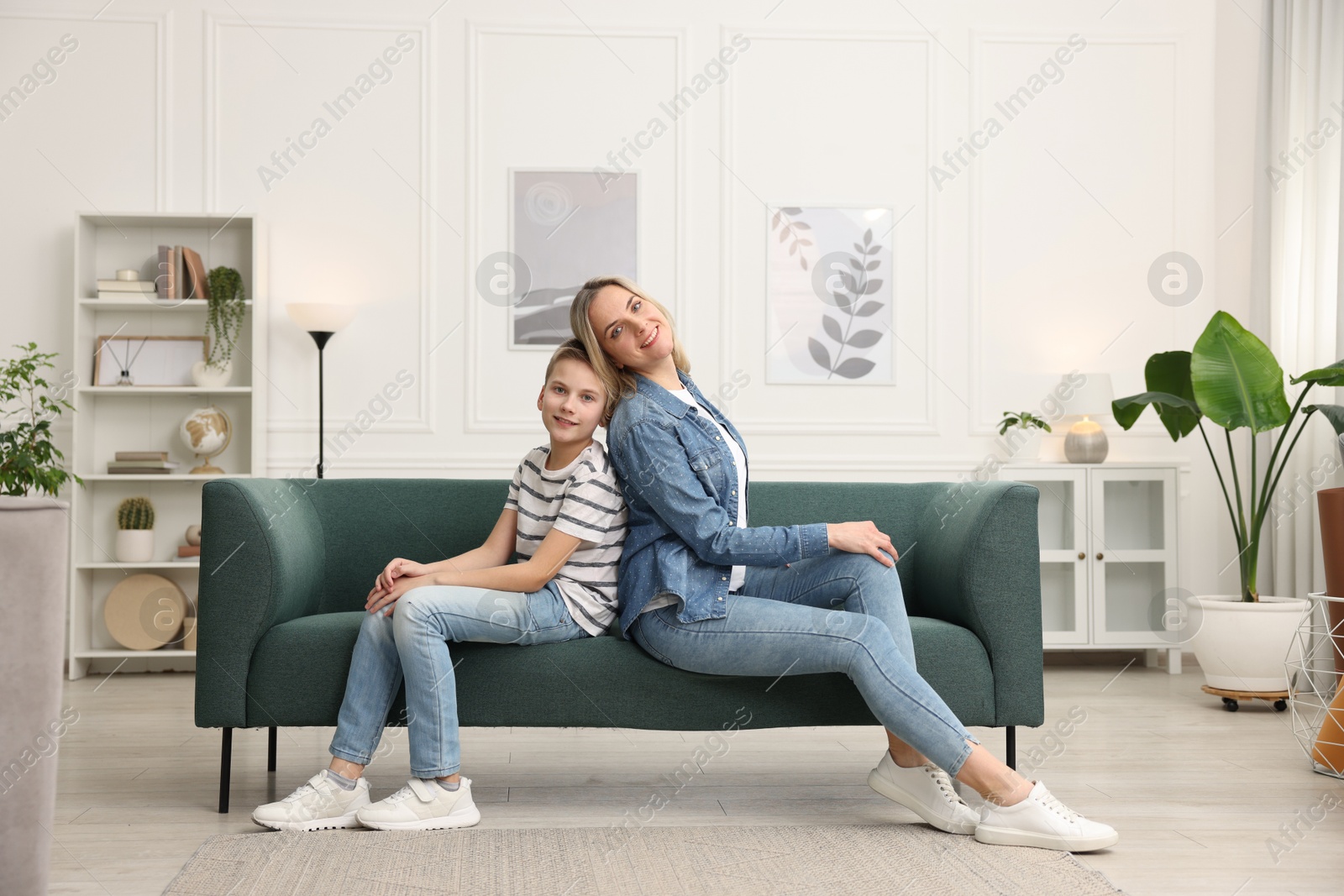 Photo of Mother and son on sofa at home