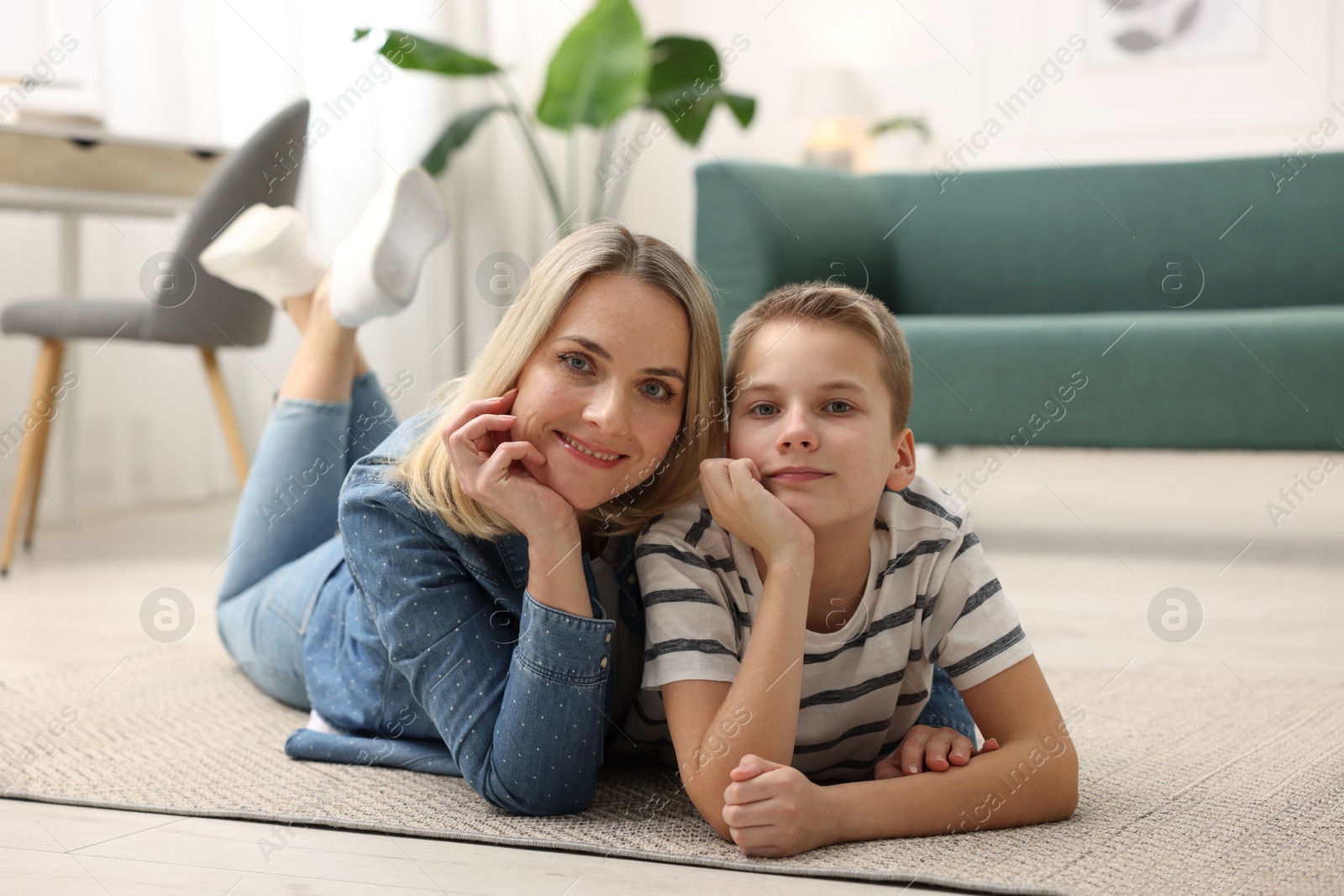 Photo of Mother and son on floor at home