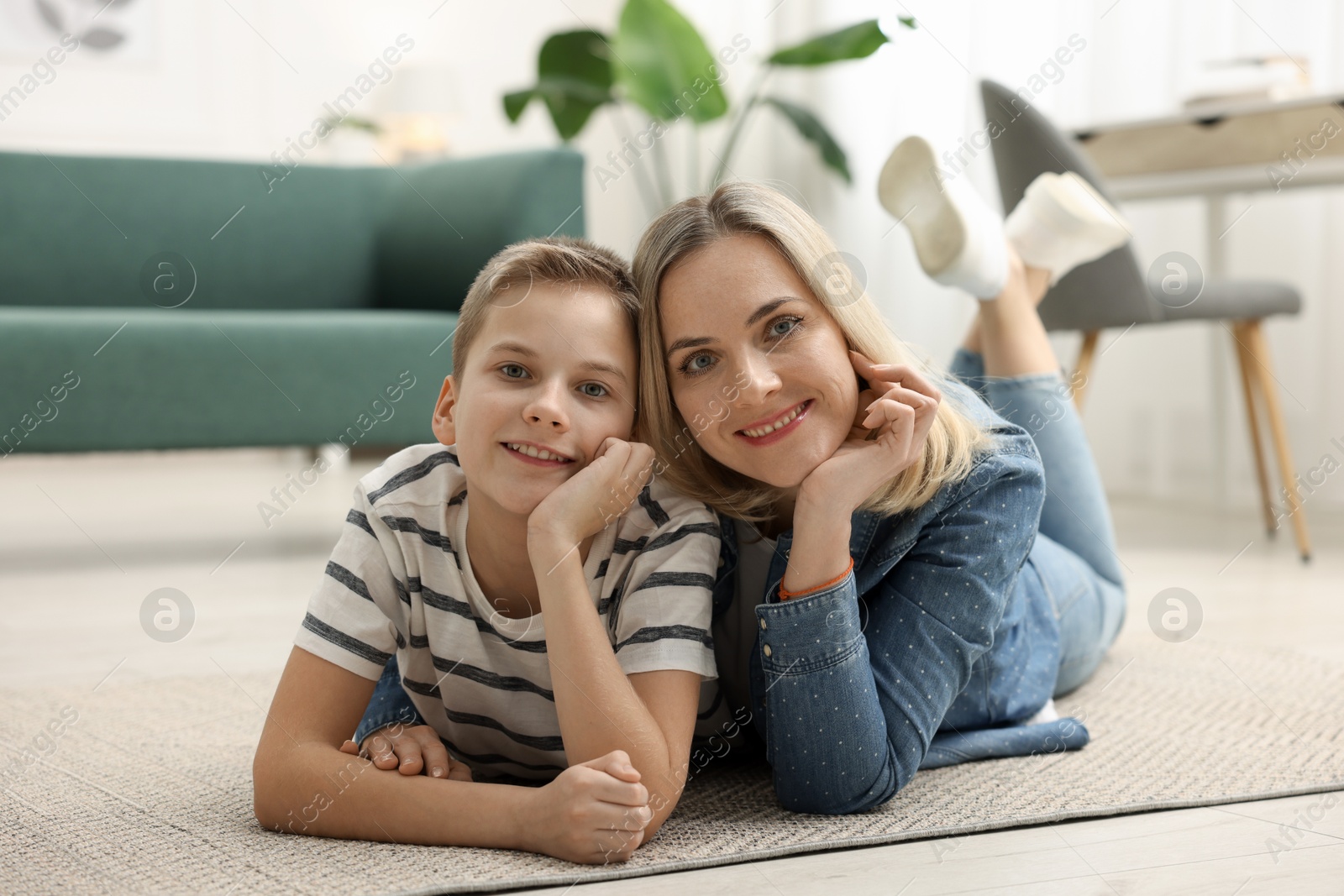 Photo of Mother and son on floor at home