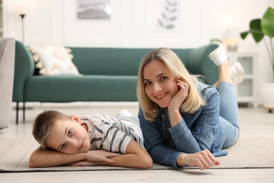 Photo of Mother and son on floor at home