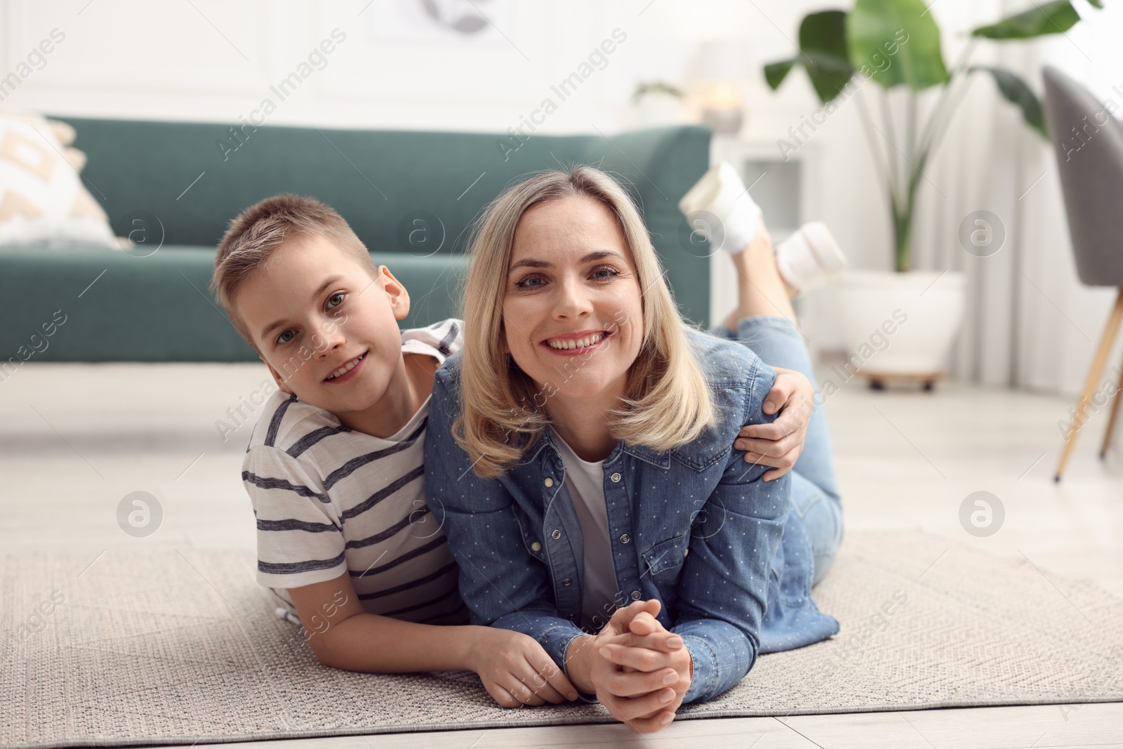 Photo of Mother and son on floor at home