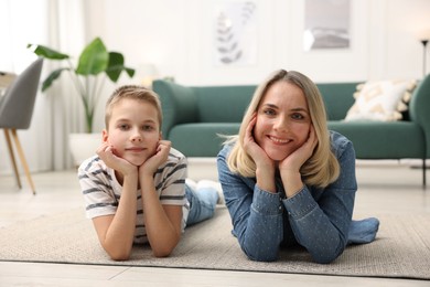 Photo of Mother and son on floor at home