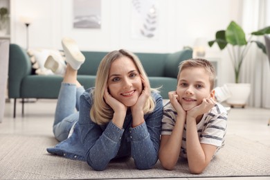 Photo of Mother and son on floor at home