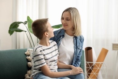 Photo of Mother and son on sofa at home