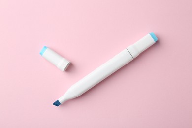 Photo of One blue double sided marker on pink background, top view