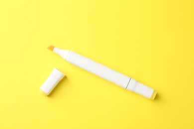 One color double sided marker on yellow background, top view