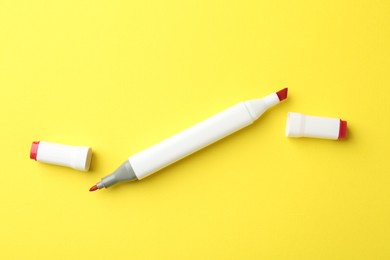 One color double sided marker on yellow background, top view