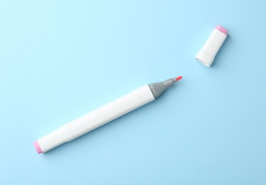 One color double sided marker on light blue background, top view