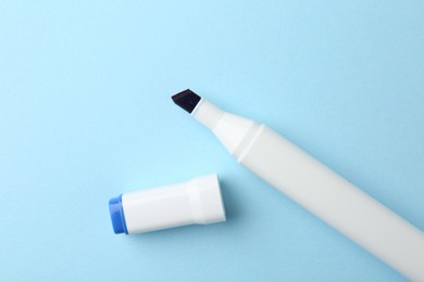 One color marker on light blue background, top view