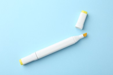 One color double sided marker on light blue background, top view