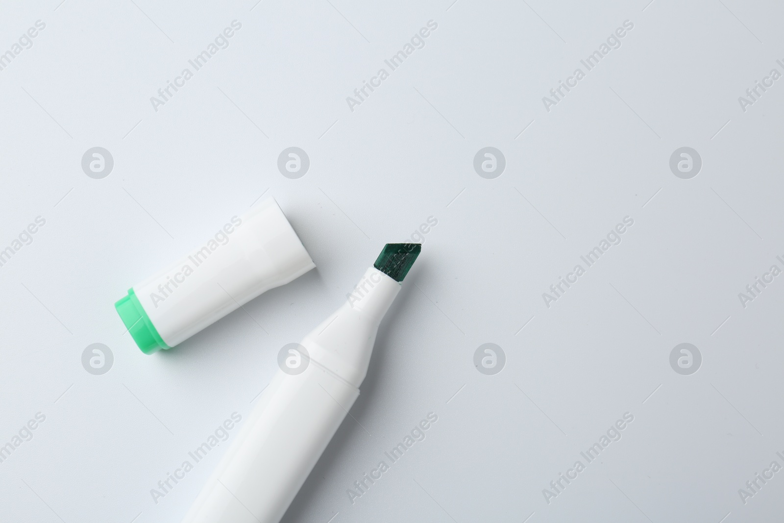 Photo of One color marker on white background, top view. Space for text