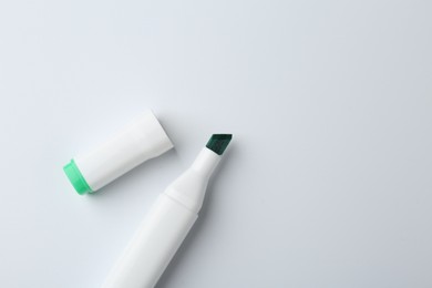 Photo of One color marker on white background, top view. Space for text