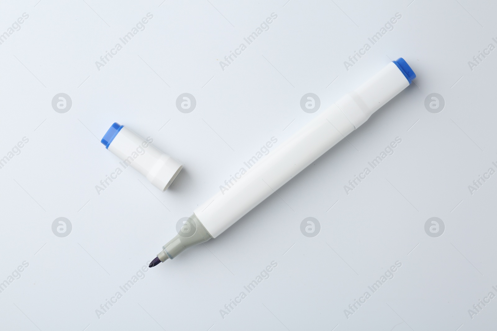 Photo of One color double sided marker on white background, top view