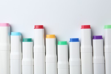 Colorful markers on white background, flat lay