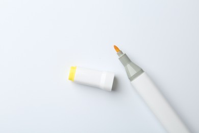 Photo of One color marker on white background, top view. Space for text