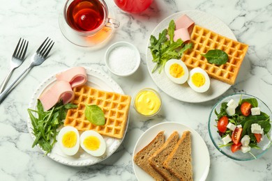 Photo of Flat lay composition with tasty brunch served on white marble table