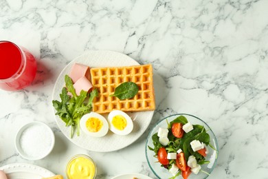 Photo of Flat lay composition with tasty brunch on white marble table. Space for text