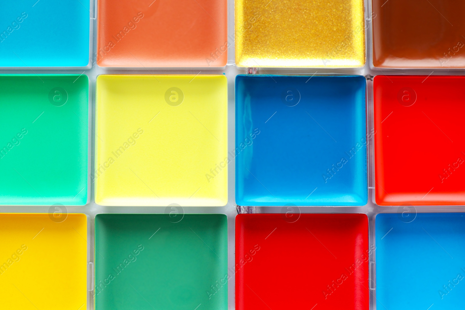 Bright face paint palette as background, top view Photo of Bright face paint palette as background, top view
