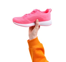 Photo of Woman with stylish pink sneaker on white background, closeup