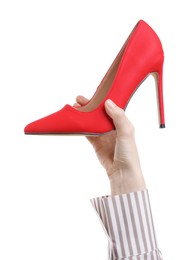 Photo of Woman with high heeled shoe on white background, closeup