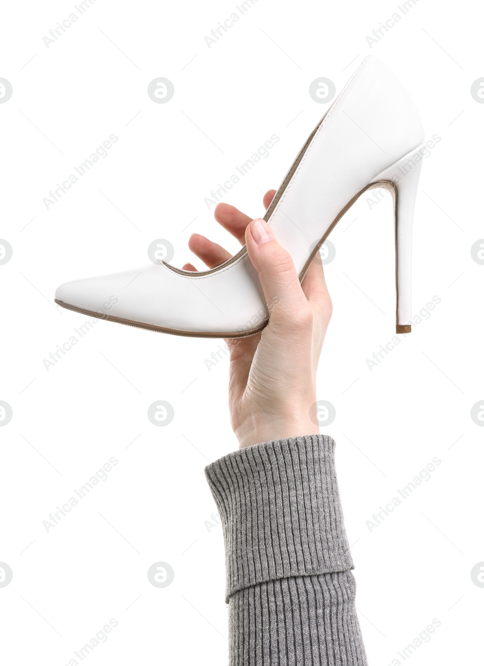 Photo of Woman with high heeled shoe on white background, closeup