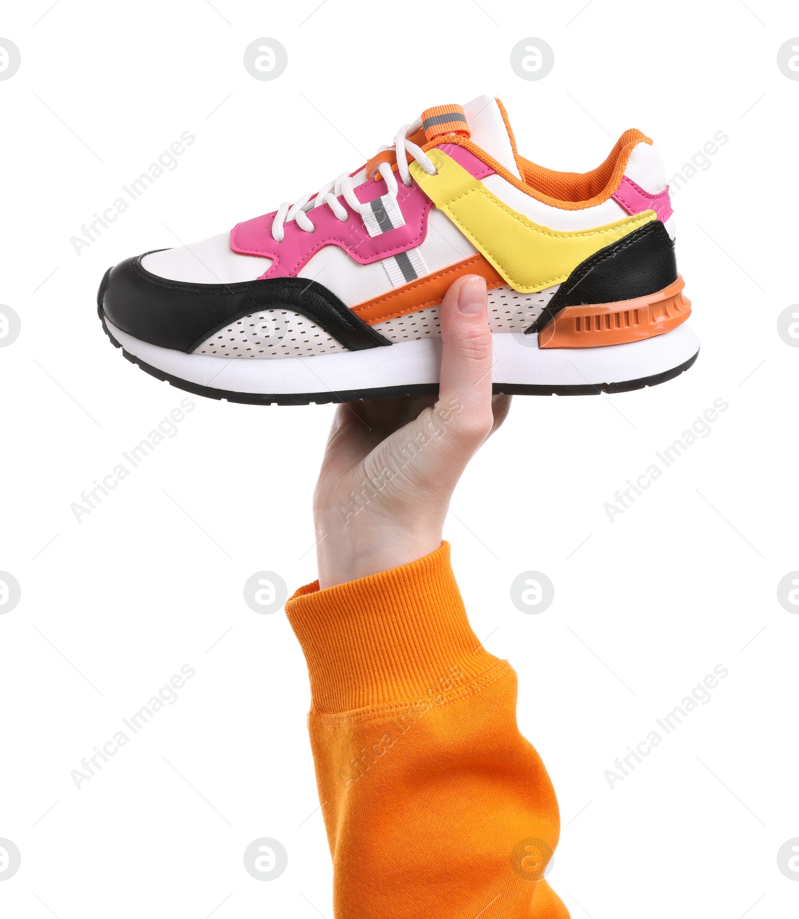 Photo of Woman with stylish colorful sneaker on white background, closeup