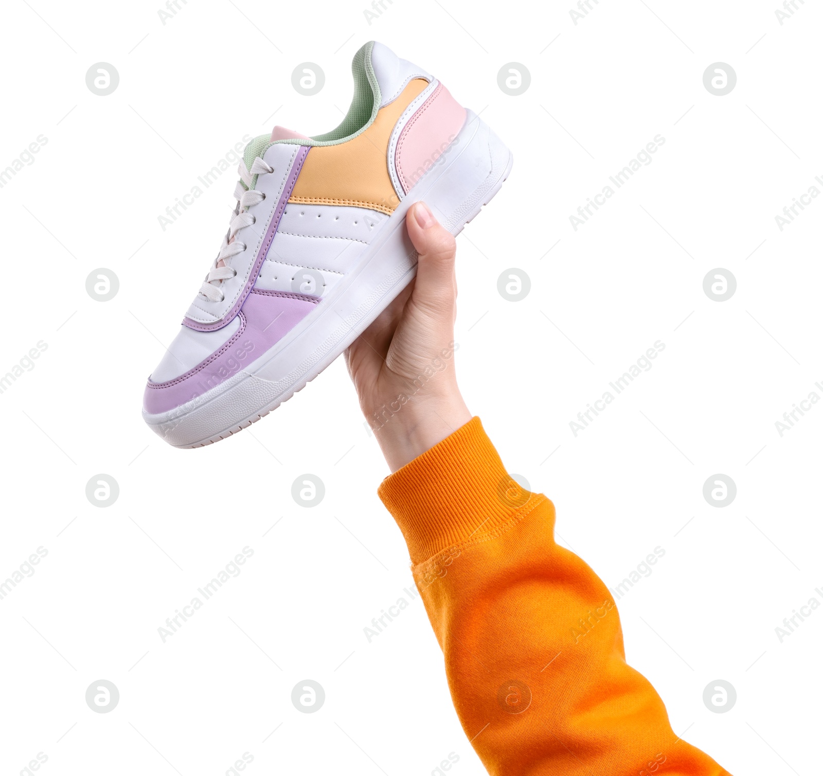 Photo of Woman with stylish colorful sneaker on white background, closeup