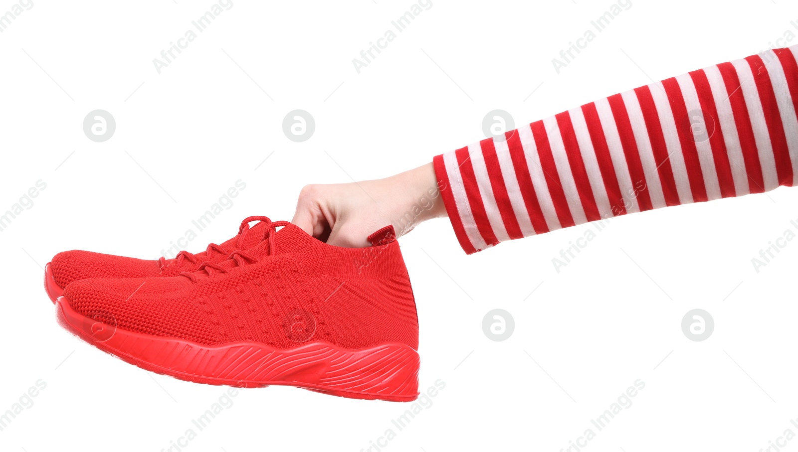 Photo of Woman with stylish red sneakers on white background, closeup