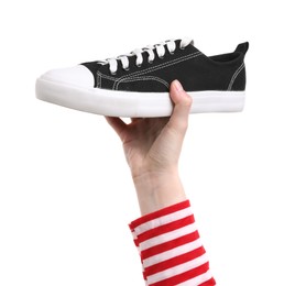 Photo of Woman with stylish black sneaker on white background, closeup