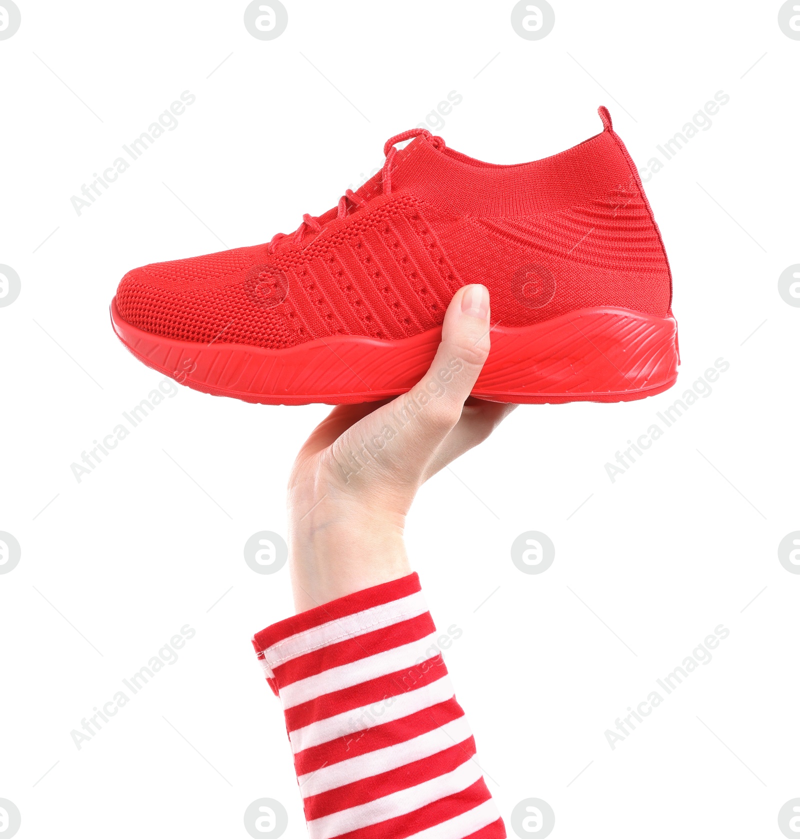 Photo of Woman with stylish red sneaker on white background, closeup