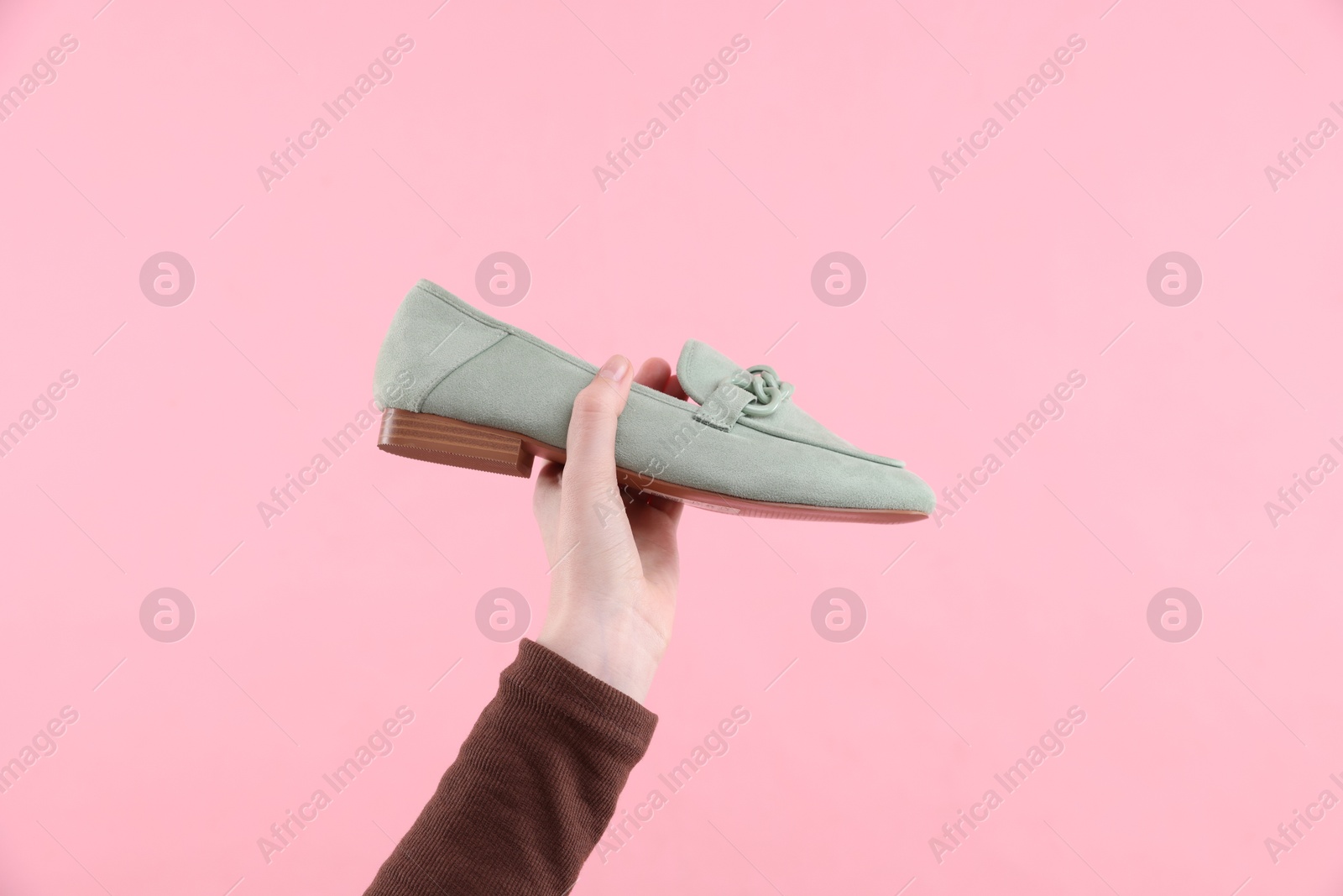 Woman with stylish shoe on pink background, closeup Photo of Woman with stylish shoe on pink background, closeup