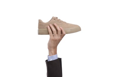 Man with stylish sneaker on white background, closeup