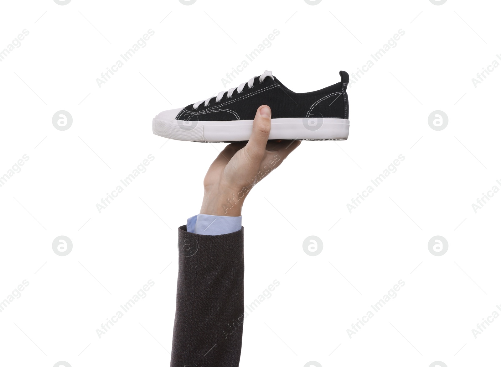 Photo of Man with stylish sneaker on white background, closeup