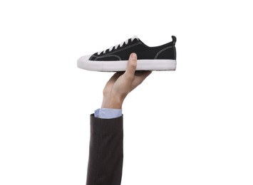 Photo of Man with stylish sneaker on white background, closeup