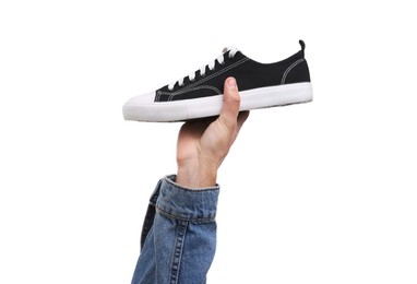 Man with stylish sneaker on white background, closeup