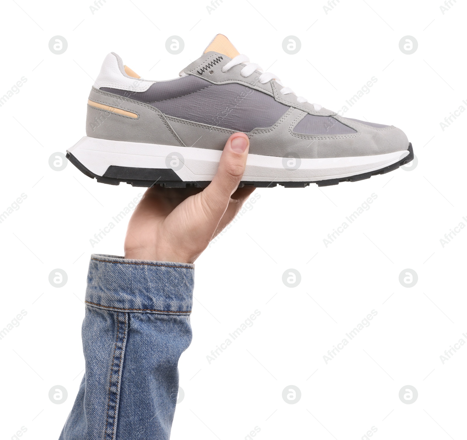 Photo of Man with stylish sneaker on white background, closeup