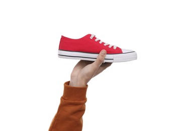 Man with stylish sneaker on white background, closeup