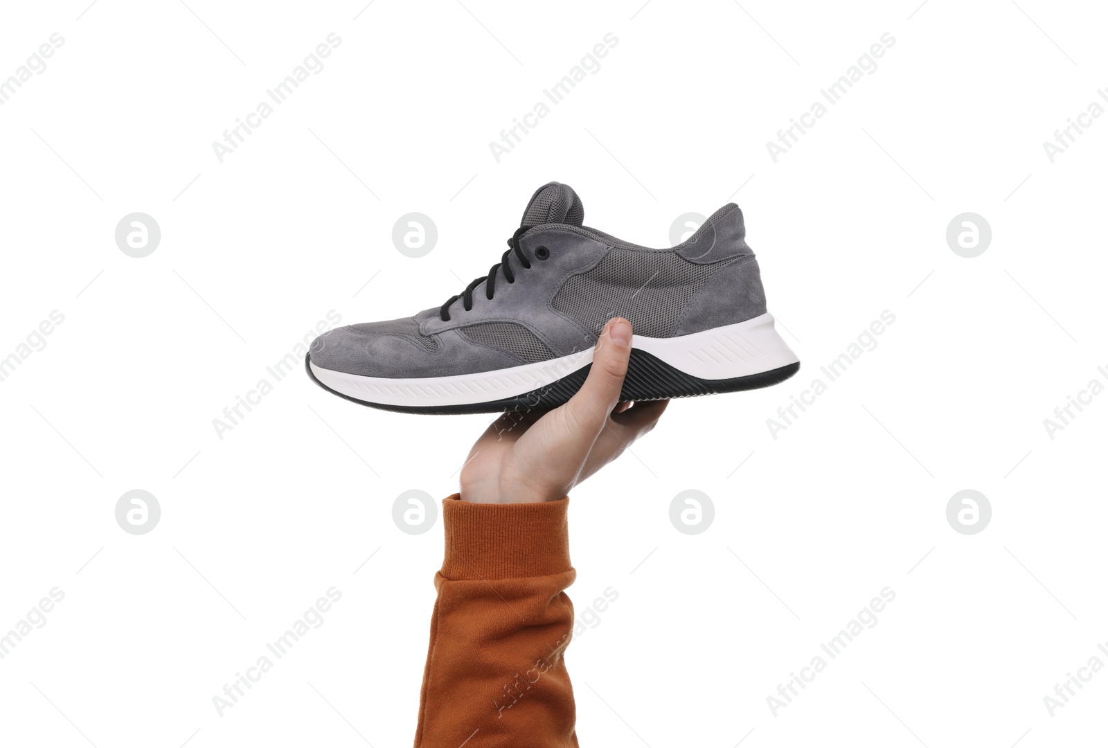 Photo of Man with stylish sneaker on white background, closeup