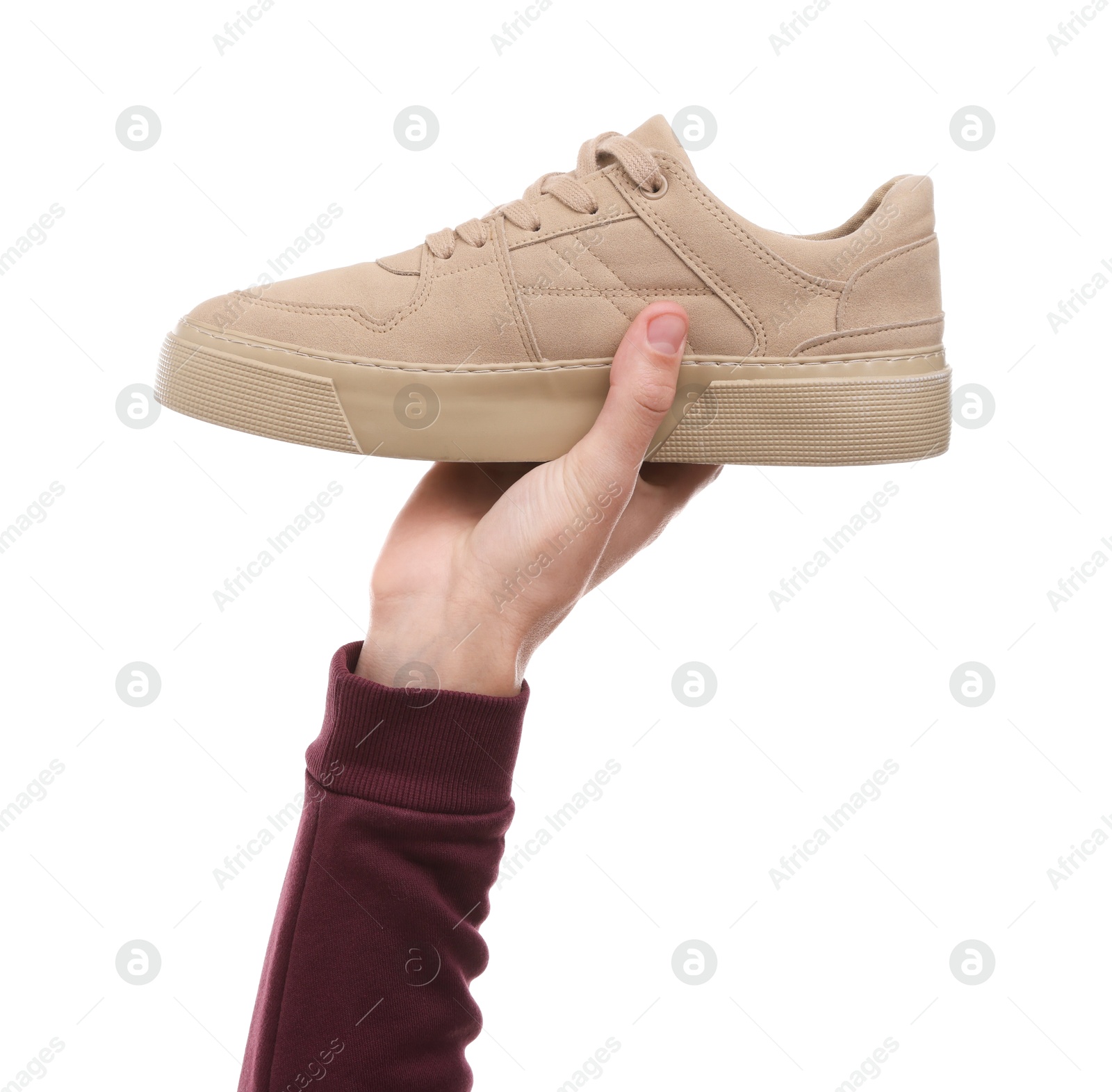 Photo of Man with stylish sneaker on white backpack, closeup