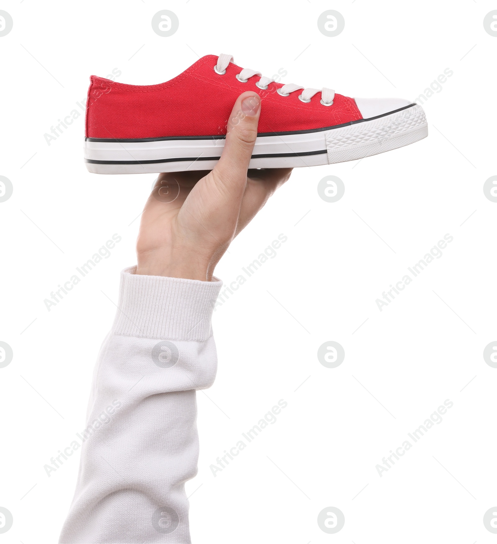 Photo of Man with stylish sneaker on white backpack, closeup