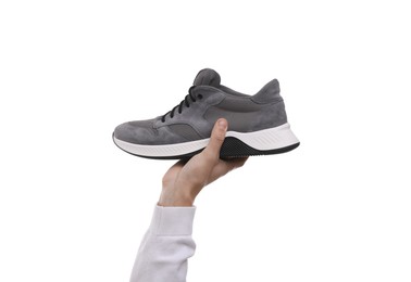 Photo of Man with stylish sneaker on white background, closeup