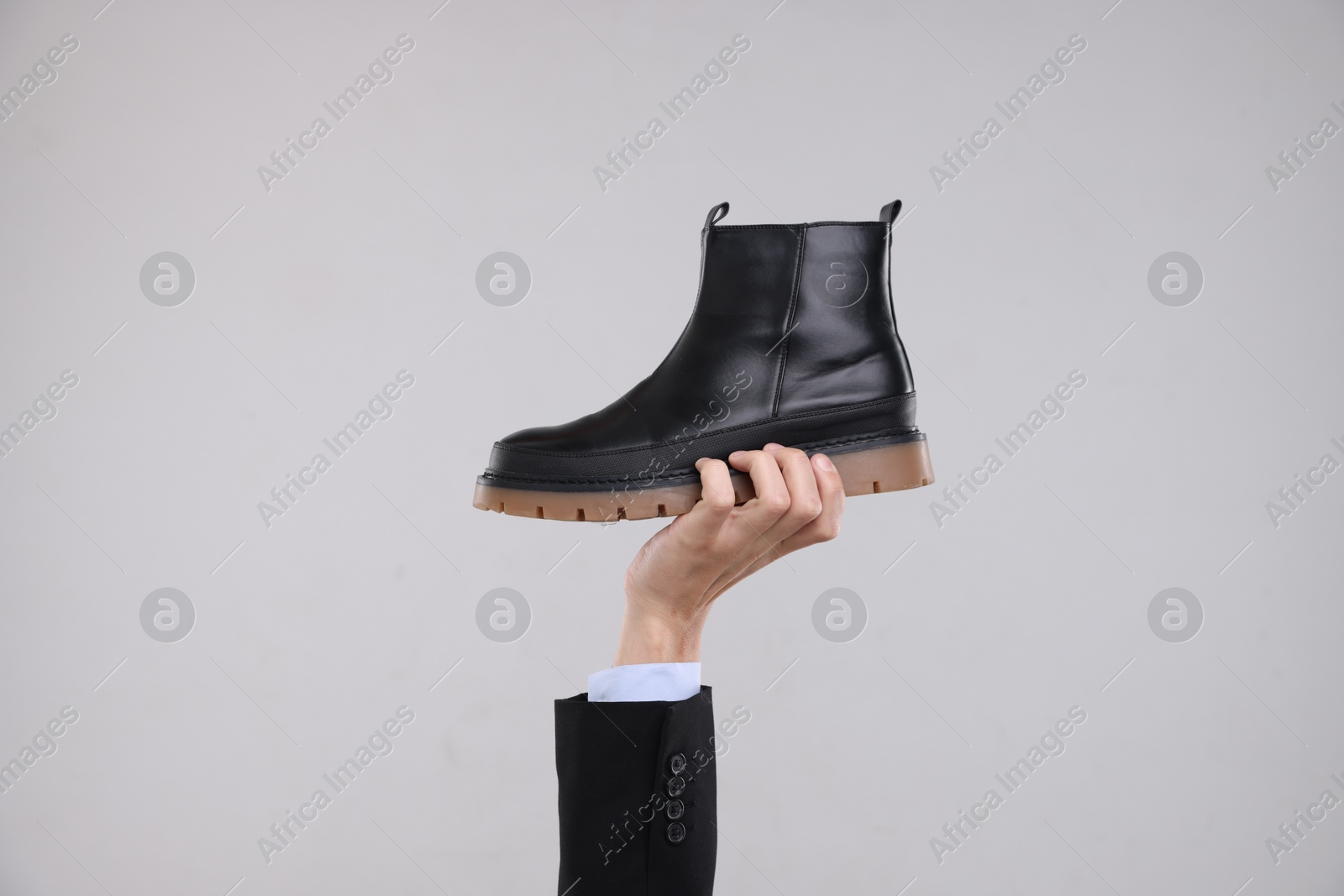 Photo of Man with stylish shoe on grey background, closeup