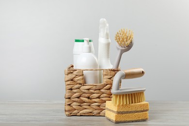 Photo of Eco-friendly cleaning products and supplies on wooden table