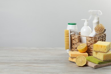 Photo of Eco-friendly cleaning products and supplies on wooden table, space for text